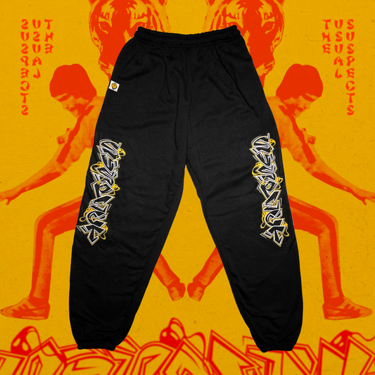 Black pants with white graphics on a yellow background with red text and images.